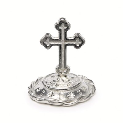 Budded cross ring stand in solid pewter on a domed rope-rim base, white background