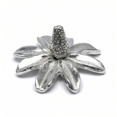 Daisy flower ring holder in solid pewter on a white background
