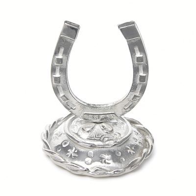 Horseshoe ring holder in solid pewter on a white background