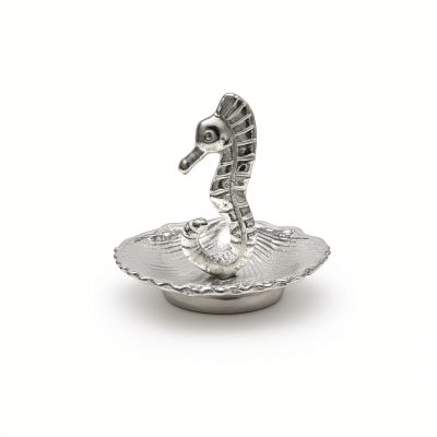 Seahorse ring holder in solid pewter rising from a scalloped shell dish on a white background