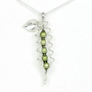 How Many Peas in Your Pod?.....They could be your children, your grandchildren or you and someone special. Each handmade pod is as unique as the wearer. Artist Lori Strickland made the first Pea Jewelry for customers in her gallery. Since then, many have tried to imitate the idea, but none can replicate the graceful flowing lines that come from unmatched quality and craftsmanship. Sterling Silver How Many Peas Necklace includes: snake chain, story card, artist bio and logo branded jewelry box. See complete description below