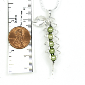How Many Peas in Your Pod?.....They could be your children, your grandchildren or you and someone special. Each handmade pod is as unique as the wearer. Artist Lori Strickland made the first Pea Jewelry for customers in her gallery. Since then, many have tried to imitate the idea, but none can replicate the graceful flowing lines that come from unmatched quality and craftsmanship. Sterling Silver How Many Peas Necklace includes: snake chain, story card, artist bio and logo branded jewelry box. See complete description below