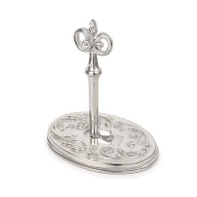 Victorian key and lock ring holder in solid pewter, an ornate skeleton key standing in an oval scrolled base, white background