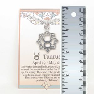 Taurus the Bull Zodiac Necklace Pewter shown with ruler for scale