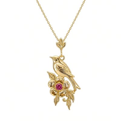 14K yellow gold songbird and flower pendant with a rhodolite garnet center on a gold chain, white background