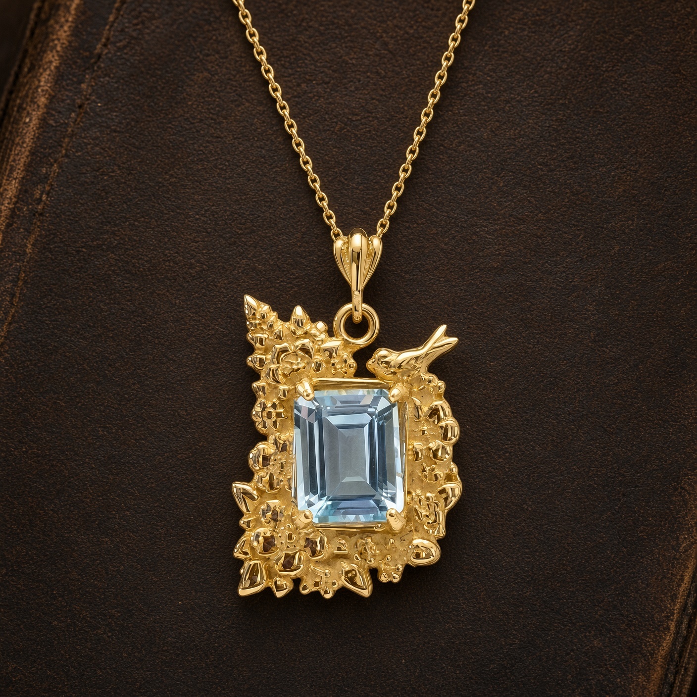 14K gold corner flower necklace with sky blue topaz against a dark brown leather book