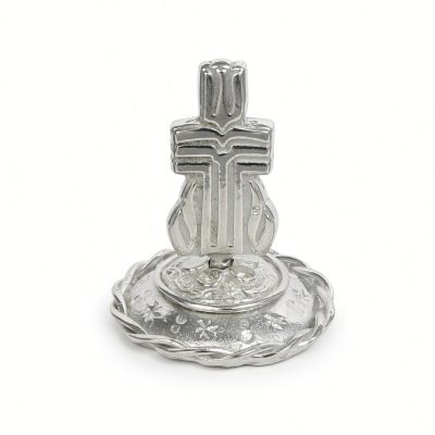 Presbyterian cross ring stand in solid pewter on a round braided rope-rim base, white background