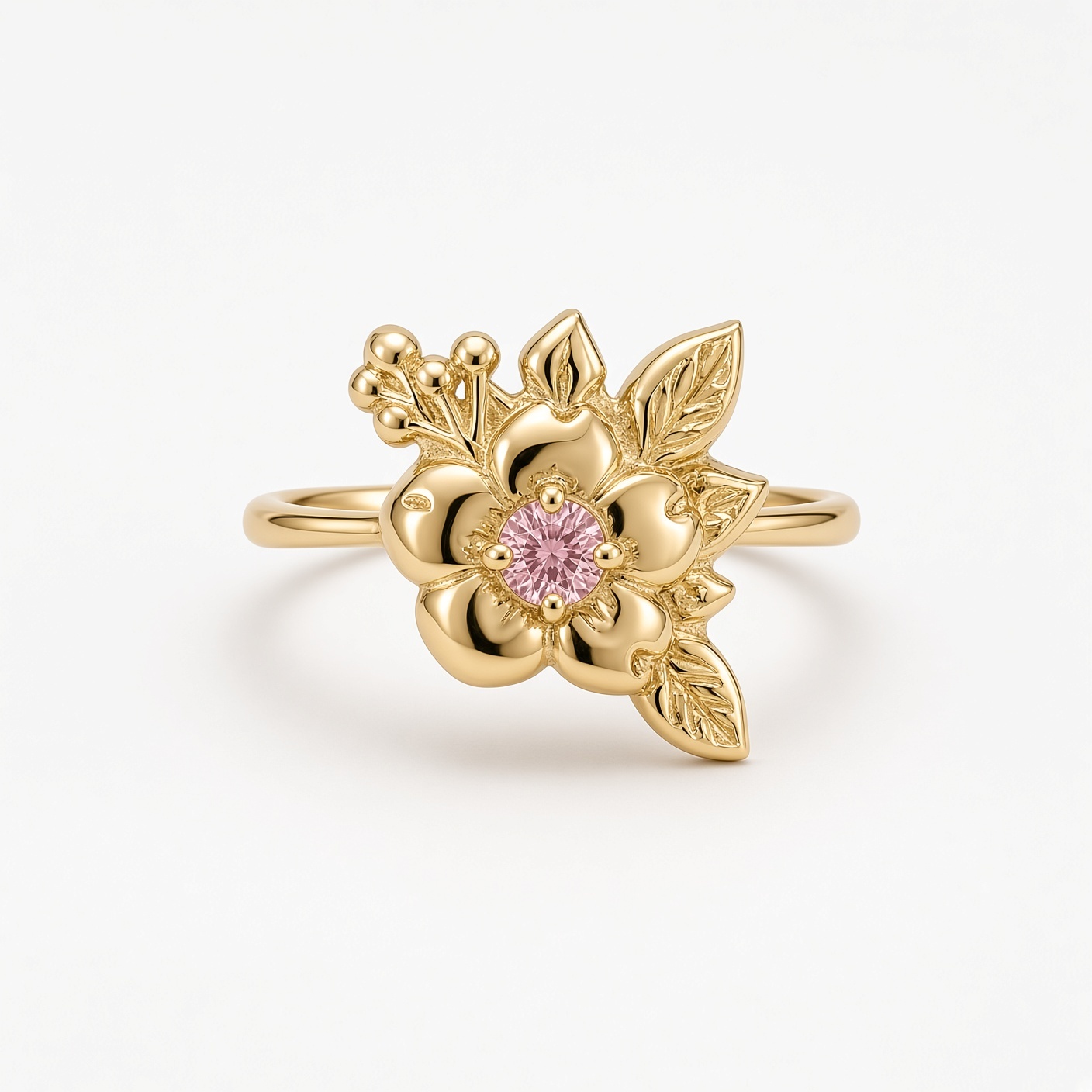 14K yellow gold wild rose ring with a round pink diamond center, sculpted leaves, and gold berries, white background