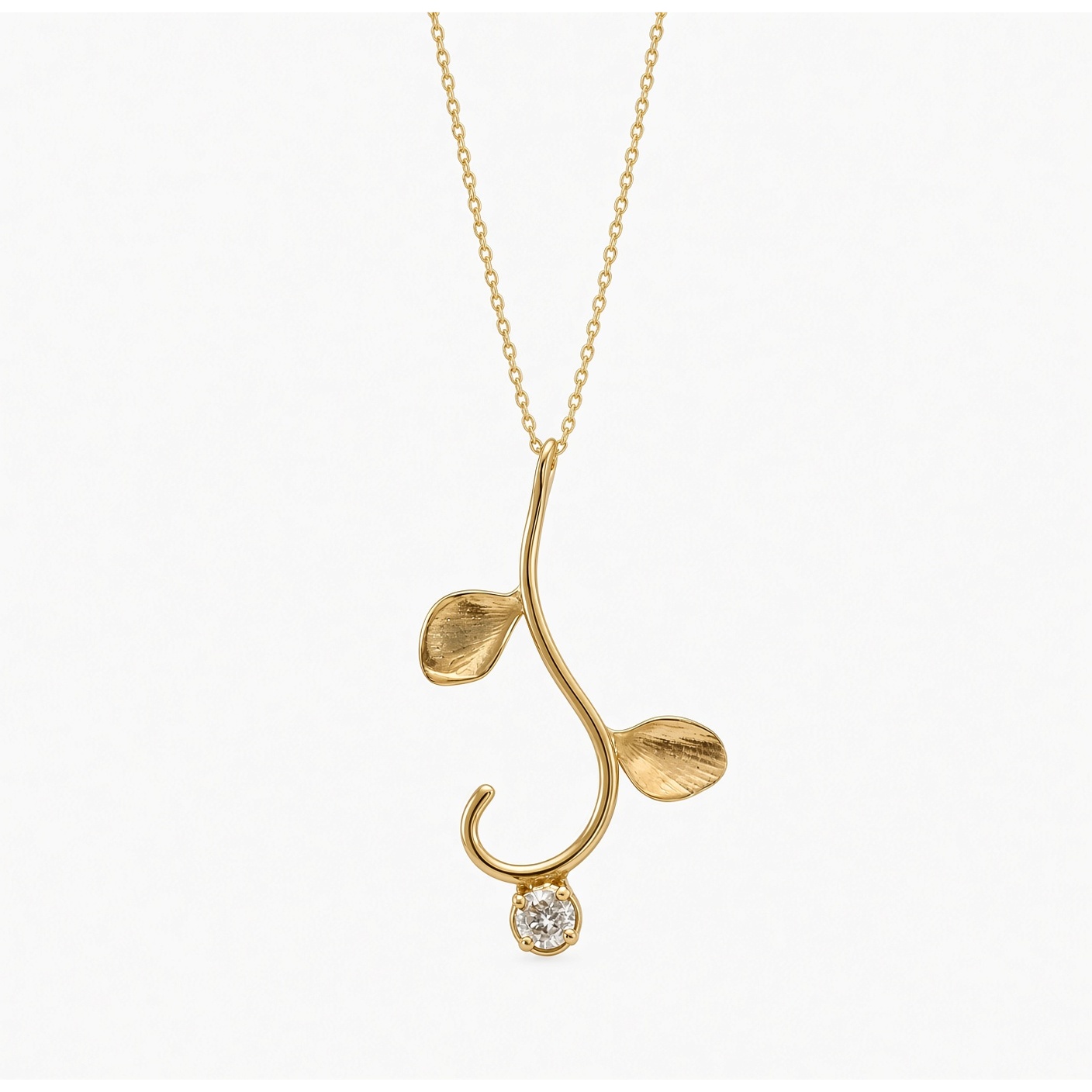 14K yellow gold vine pendant with two leaves and a round diamond on a gold chain, white background