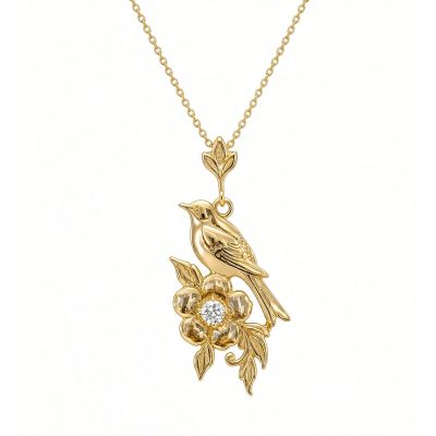 14K yellow gold bird and flower pendant with a center diamond on a gold chain, white background