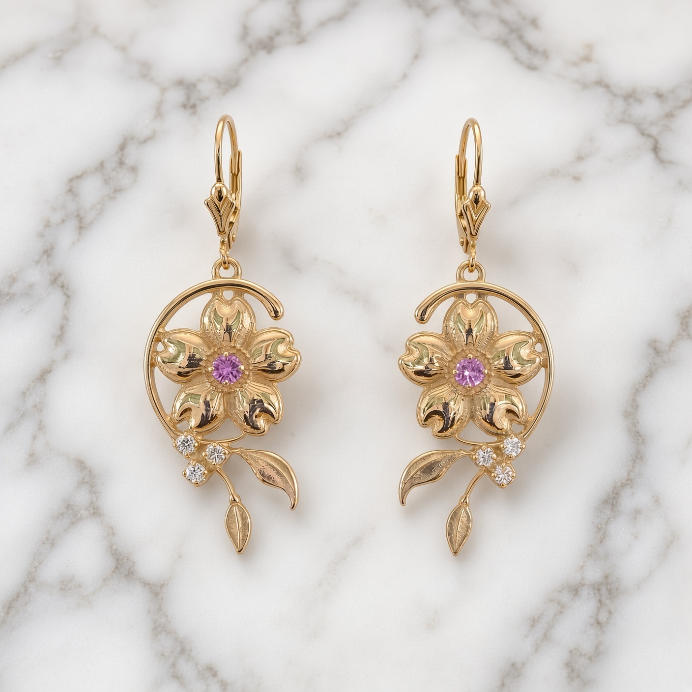 Cherry blossom lever back earrings in 14K yellow gold on white and gray marble