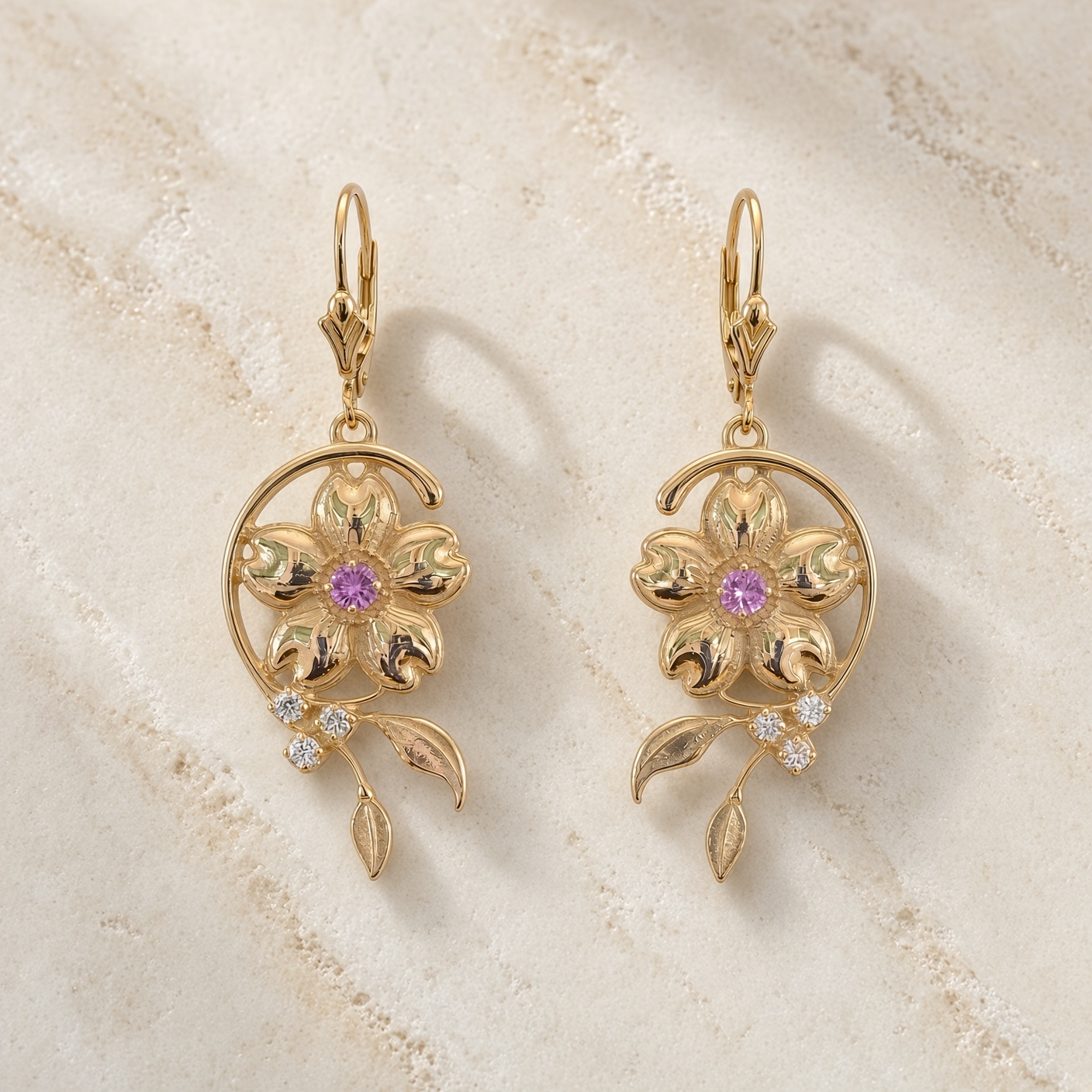 Art nouveau cherry blossom earrings in 14K gold with diamonds on cream travertine stone