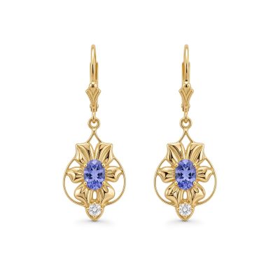 Nouveau Flower Earrings in 14K yellow gold with oval tanzanites and diamond drops on fleur lever backs, on a white background