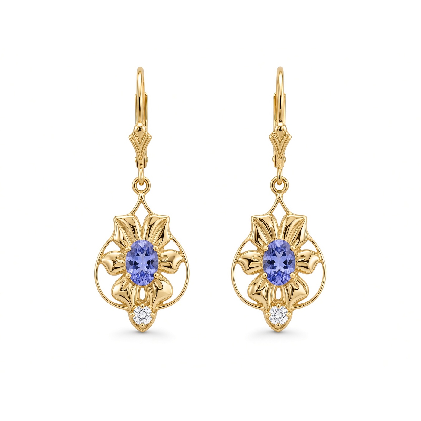 Nouveau Flower Earrings in 14K yellow gold with oval tanzanites and diamond drops on fleur lever backs, on a white background