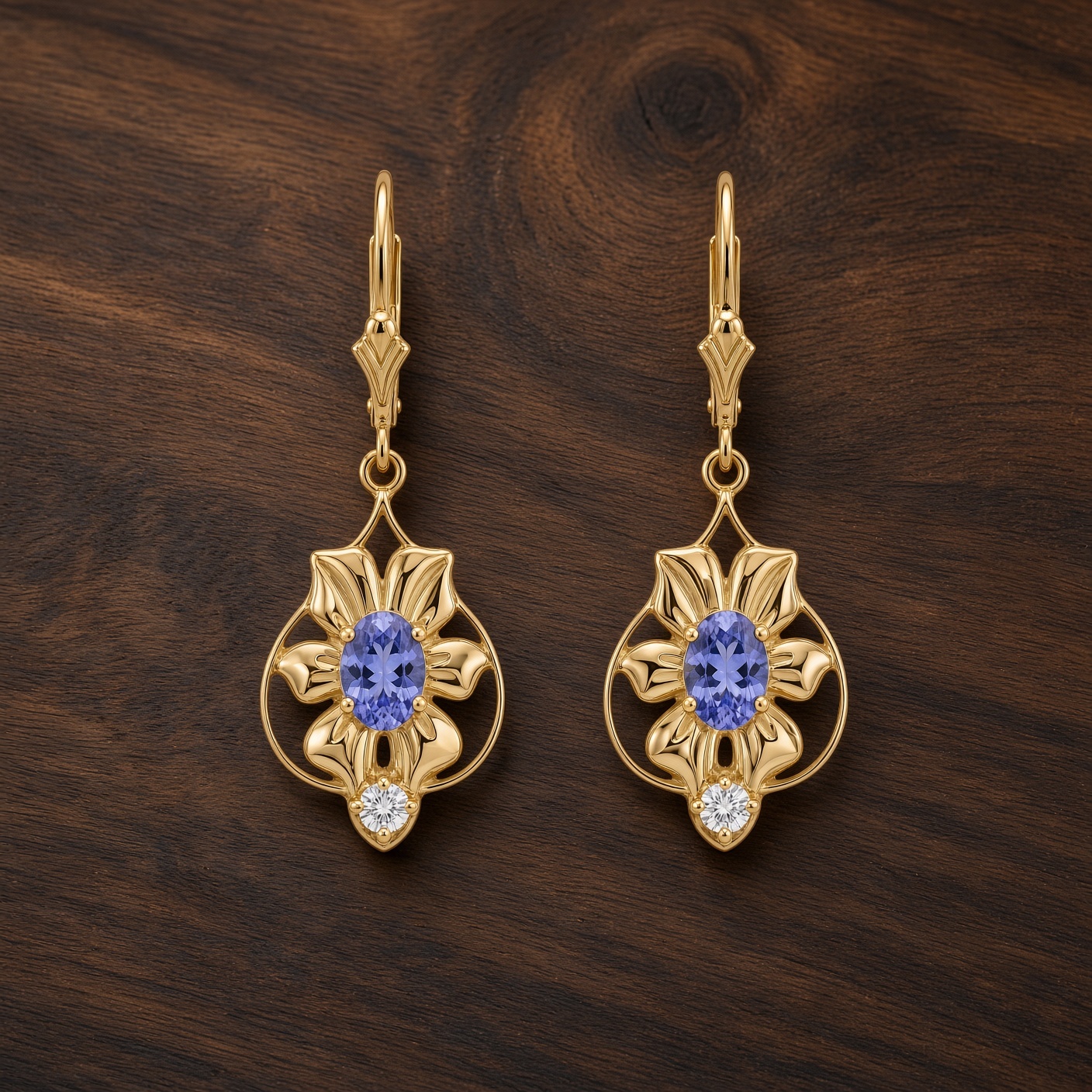 Gold art nouveau flower earrings with violet-blue tanzanites displayed on dark wood