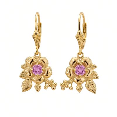 Pair of 14K yellow gold flower drop earrings with pink sapphire centers on lever backs, white background
